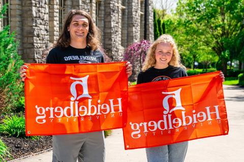 students holding heidelberg flags